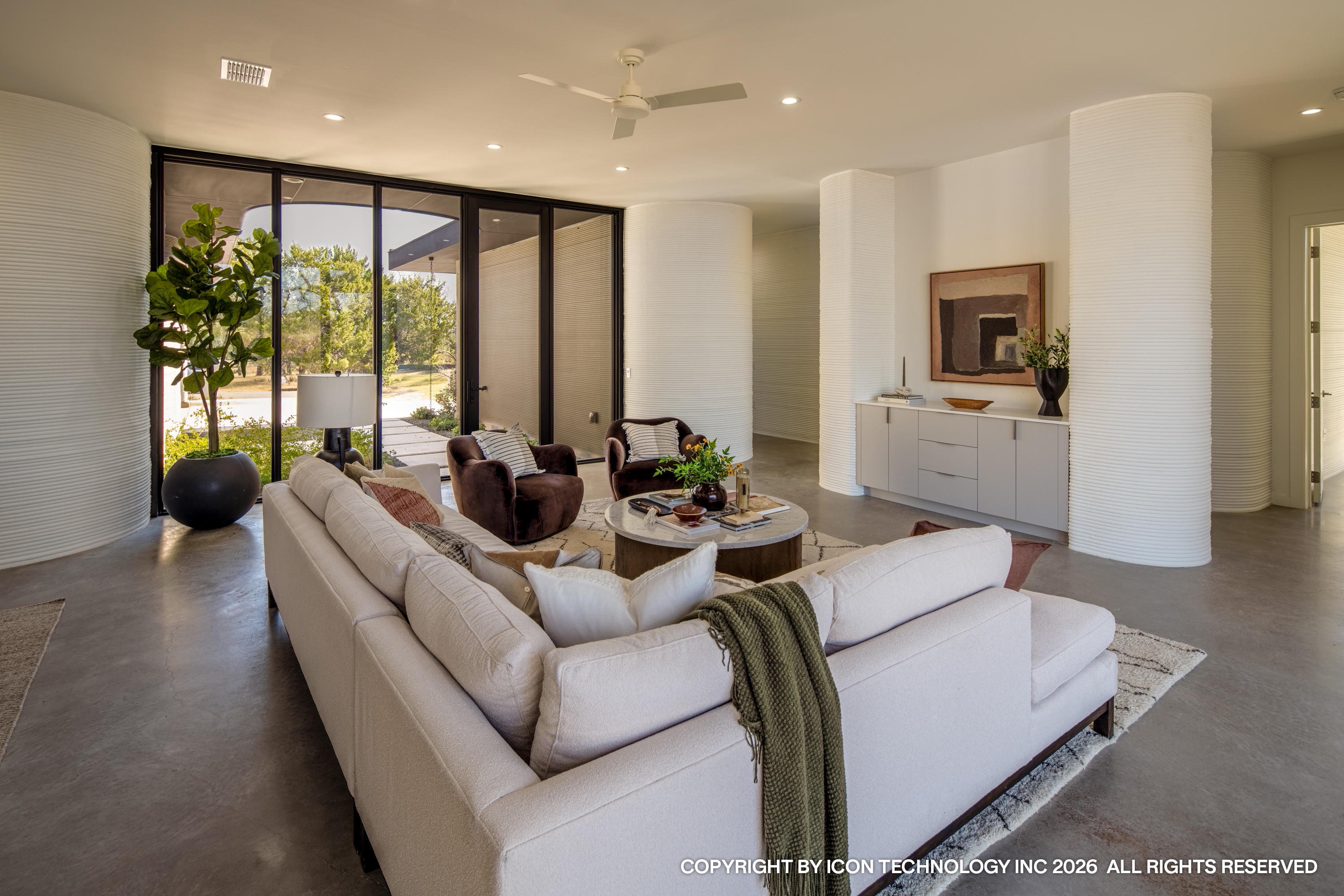 Living room with white sectional and printed columns
